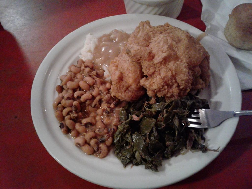 Fried chicken, collard greens, black eyed peas, and gravy. Rice would have been rare